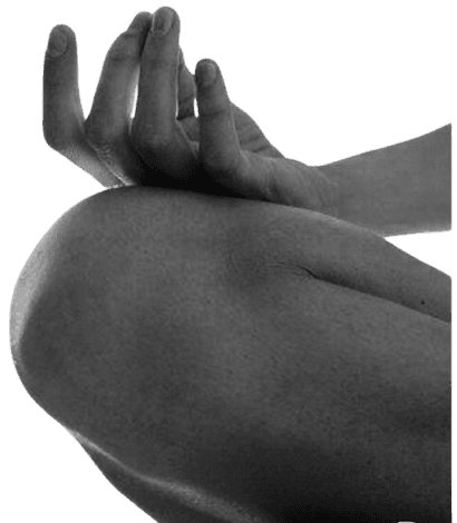 Person in meditation pose at MYST 30A Yoga studio